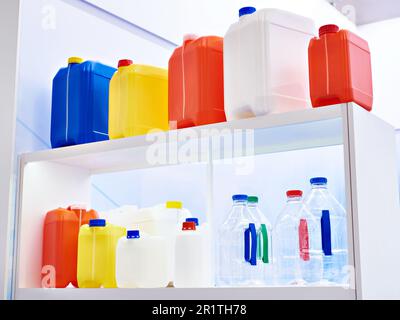 Plastic canisters at the store exhibition Stock Photo