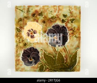 Antique 1900s Minton Art Nouveau Pansy pottery tile Stock Photo