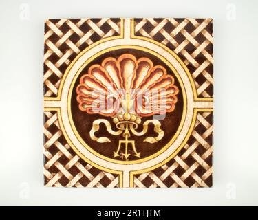 Antique 1890s Victorian hand coloured transfer printed scollop and trident pottery tile Stock Photo