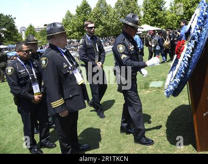 Washington, United States. 15th May, 2023. Troopers pause for a moment of silence at a wreath during the annual gathering for National Police Week, on Capitol Hill, Monday, May 15, 2023, in Washington, DC. Law enforcement agencies from across the country meet to honor police officers who have fallen in the line of duty. Photo by Mike Theiler/UPI Credit: UPI/Alamy Live News Stock Photo