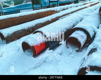 material for repair work. sewer pipes for laying communications in a residential area. long, black polypropylene pipes. Stock Photo