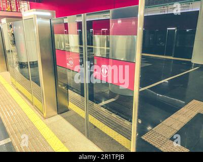 underground passage in the subway. The tunnel is protected by transparent plastic walls. safety of passengers from falling onto the train line. Stock Photo