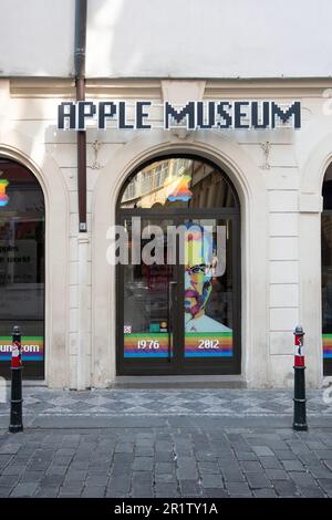 The facade of the Apple Museum in Prague, Czechia with an artsy pic of Steve jobs on the door. Stock Photo