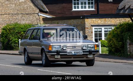 Stoke Goldington,Northants,UK - May 14th 2023. 1982 FORD GRANADA GHIA AUTO estate classic car driving through an English village Stock Photo