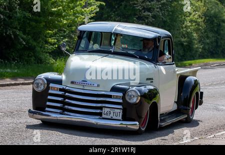 Stoke Goldington,Northants,UK - May 14th 2023. 1950 CHEVROLET  PICK UP TRUCK classic car driving through an English village Stock Photo