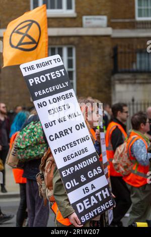 London, UK. 13th May, 2023. Members of Just stop Oil slow march in Westminster. The slow march is part of ongoing civil disobedience to put pressure on the British Government to end all new oil and gas consents and licences. Abdullah Bailey/Alamy Live News Stock Photo