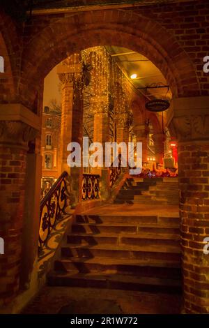 Archway and stairs leading to a neoclassical building and restaurant in winter in Oslo, Norway Stock Photo