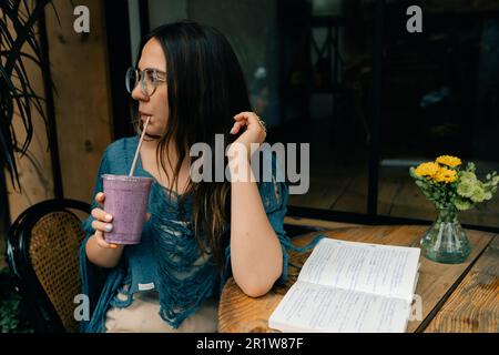 girl drinking smoothies in a cafe. High quality photo Stock Photo