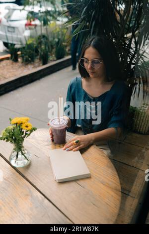 girl drinking smoothies in a cafe. High quality photo Stock Photo