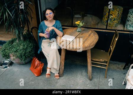 girl drinking smoothies in a cafe. High quality photo Stock Photo