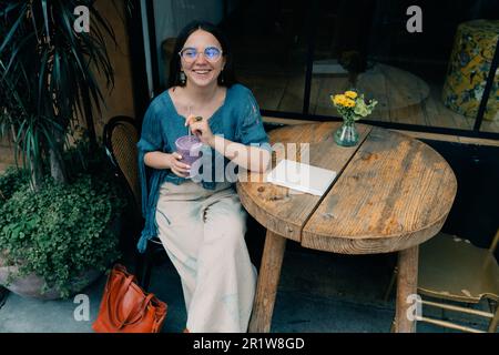 girl drinking smoothies in a cafe. High quality photo Stock Photo