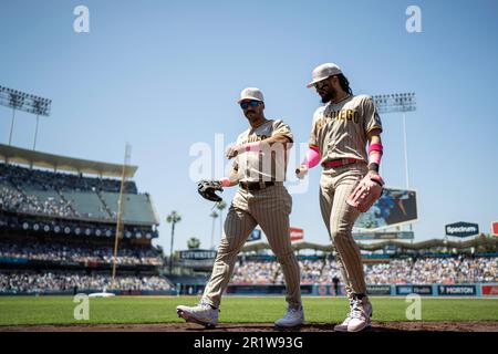 San Diego Padres right fielder Fernando Tatis Jr. (23) and center fielder Trent Grisham (1) return to the dugout during a MLB game against the Los Ang Stock Photo