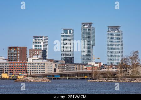 Newly built residential Sompasaari district against a backdrop of Kalasatama high-rise buildings in Helsinki, Finland Stock Photo