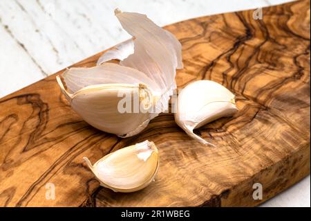 Garlic cloves on the cutting board Stock Photo