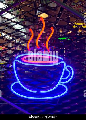 Illuminated hot coffee.Bright colored collection of symbols or sign boards glowing with colorful neon light for cafe, restaurant, motel, cocktail bar. Stock Photo