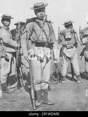 Chinese infantrymen in full combat gear. Photo from 1911. Stock Photo
