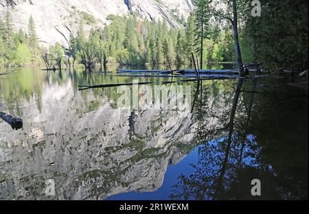 Cliffs reflected in Mirror Lake - Yosemite NP - California Stock Photo