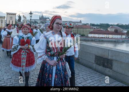 Prague, Czech Republic. 15th May, 2023. Moravian women dressed in national costumes attend the Navalis celebrations on the Charles bridge in Prague. Navalis Saint Johns celebrations take place to commemorate Czech saint and Prague native, Saint John of Nepomuk, patron of all people of the water. Credit: SOPA Images Limited/Alamy Live News Stock Photo