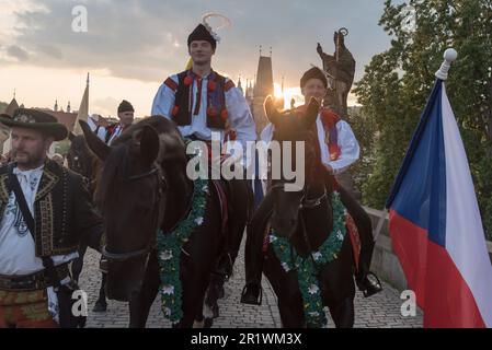 Prague, Czech Republic. 15th May, 2023. Moravians dressed in national costumes ride horses during the Navalis celebrations on the Charles bridge in Prague. Navalis Saint Johns celebrations take place to commemorate Czech saint and Prague native, Saint John of Nepomuk, patron of all people of the water. (Photo by Tomas Tkacik/SOPA Images/Sipa USA) Credit: Sipa USA/Alamy Live News Stock Photo