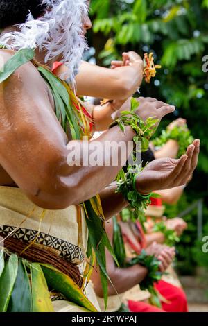 Kingdom of Tonga, Neiafu. Traditional welcome dancers in typical taʻovala, woven mat skirt worn by both men and women. Stock Photo