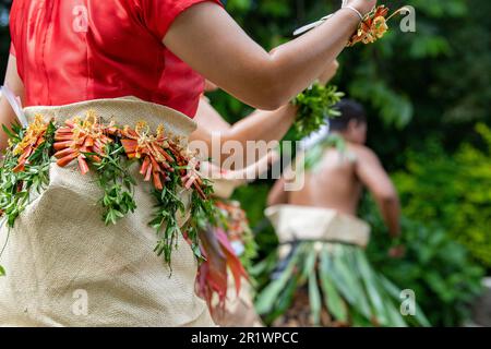 Kingdom of Tonga, Neiafu. Traditional welcome dancers in typical taʻovala, woven mat skirt worn by both men and women. Stock Photo