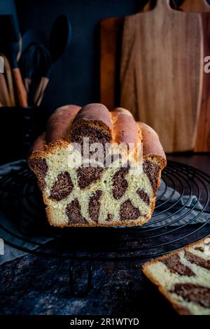 Sliced Loaf of Leopard Milk Bread on a Cooking Rack : A loaf of Japanese milk bread with leopard or giraffe spots colored with cocoa powder Stock Photo