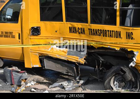 The Bronx, New York, USA. 15th May, 2023. School bus involved in an accident left with a gaping hole and extreme damage at the crime scene following the accident. Multiple people were hurt in a school bus crash in Bronx, New York on Monday afternoon. Police say at approximately 3:15 p.m. there was a collision involving the bus and two other vehicles at the Einstein Loop by Hutchinson River Parkway East. Credit: SOPA Images Limited/Alamy Live News Stock Photo