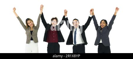 Group of asian business people wearing suit raise hands together, feeling happy and smiling, completed finished job. Successful team and team building Stock Photo