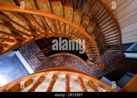 Looking down over a semi spiral staircase inside a large home.  This house has since been demolished. Stock Photo
