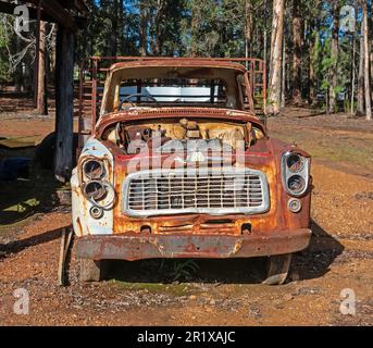 An old International Harvester truck rusting away at Donnelly River Village in Western Australia. Stock Photo