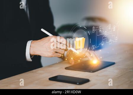 Document Management System (DMS). Digital online document database and paperless office. Businessman use tablet with folder process automation to effi Stock Photo