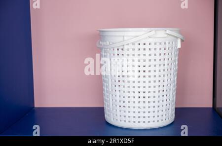 Empty new white plastic laundry clothes basket at convenience store Stock Photo