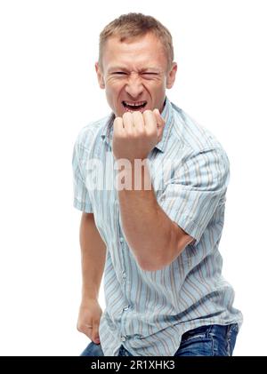 Confidence grows with age. A cropped portrait of a happy middle-aged man air punching isolated on white. Stock Photo