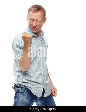 Confidence grows with age. A cropped portrait of a happy middle-aged man air punching isolated on white. Stock Photo