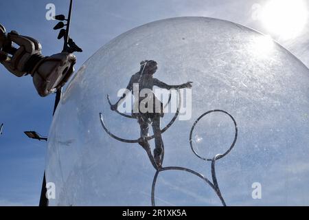 An acrobat performs during the carnival. The parade of The Marseille Carnival was held at the Old Port of Marseille on May 6, where hundreds of people gather to witness and enjoy the event. Stock Photo