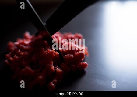 Steak tartare, steak tartare or beef tartare is a dish made from raw minced beef. Stock Photo