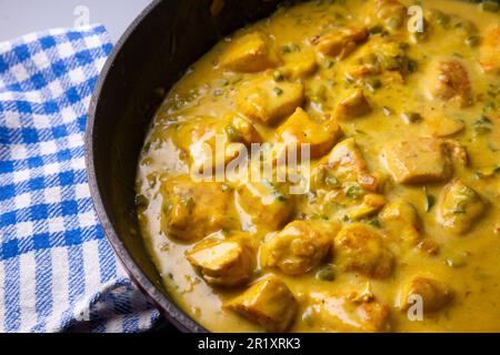 Chicken curry with yellow coconut sauce. Stock Photo