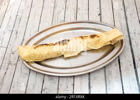 A durum is a way of presenting the doner rolled in a flatbread, widely used in Turkish cuisine. Two types of flatbread can be used to make it Stock Photo