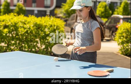 Cute Kids Playing Table Tennis Sports with Racket and Ball of Ping Pong  Game Match in Flat Cartoon Hand Drawn Templates Illustration Stock Photo -  Alamy