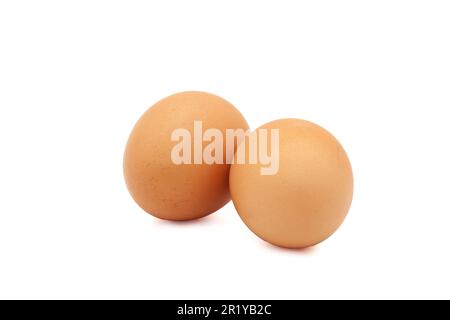 Two brown eggs from a chicken on a white background. Isolated. Photo in high quality. Stock Photo