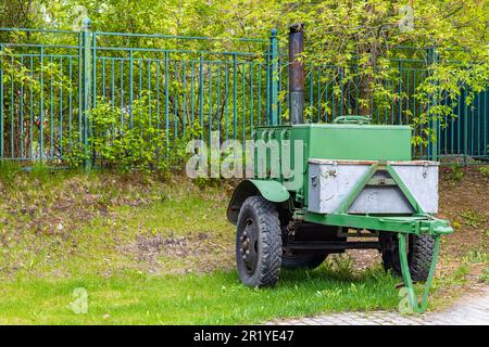 mobile field kitchen stands in the park. field kitchen trailer Stock Photo