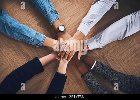 Goals, strategy or hands of business people in support for faith, community or planning in startup office. Teamwork, vision or above of employees in Stock Photo