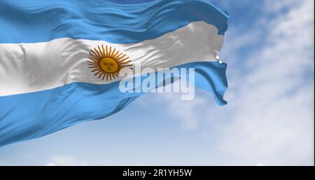 Argentina national flag fluttering in the wind on a sunny day. Three equal blue and white horizontal bands with the Sun of May in the center. 3d illus Stock Photo