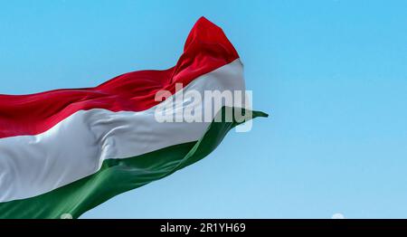 The national flag of Hungary fluttering in the wind on a clear day. Horizontal striped flag of red, white and green. 3d illustration render. Flutterin Stock Photo