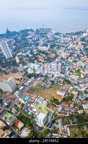 Skyline of Pattaya city at sunset with The Sanctuary of Truth wooden ...