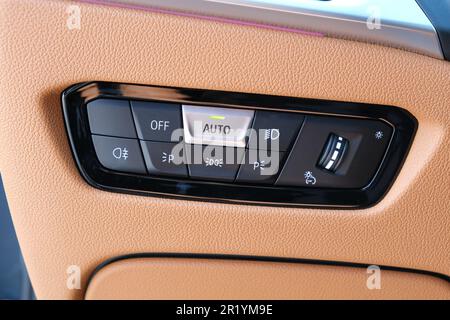 Close up car headlamp buttons dashboard inside of car. Selective focus. Stock Photo