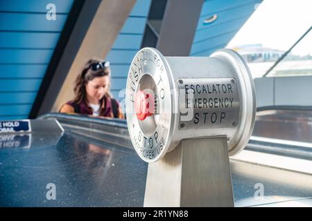 A red emergency stop button to stop a set of escalators at Reading Railway station in Berkshire, UK Stock Photo
