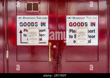 Back stage door at The Dominion Theatre in London with instructions about deliveries attached to the door Stock Photo