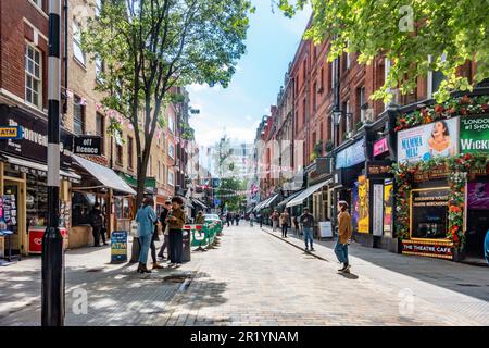 A view down Monmouth Street in the Seven Dials area of London with The Theatre Cafe on the right. Stock Photo