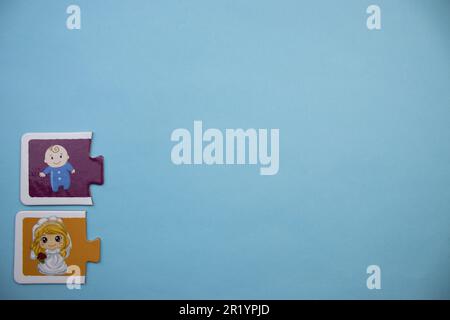 Information puzzle placed on the edge of the blue background. Baby and mom. Stock Photo